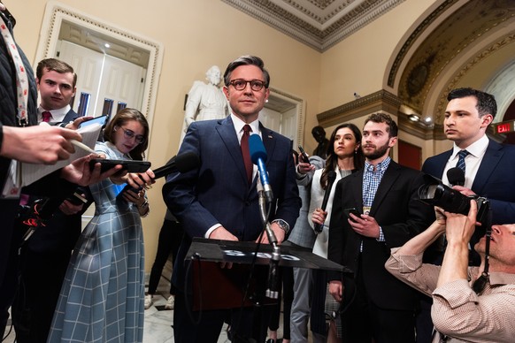epa11290747 US Speaker of the House Mike Johnson (C) speaks to reporters after the House approved foreign aid packages to Ukraine, Israel, and Taiwan, as well as a bill requiring TikTok?s parent compa ...