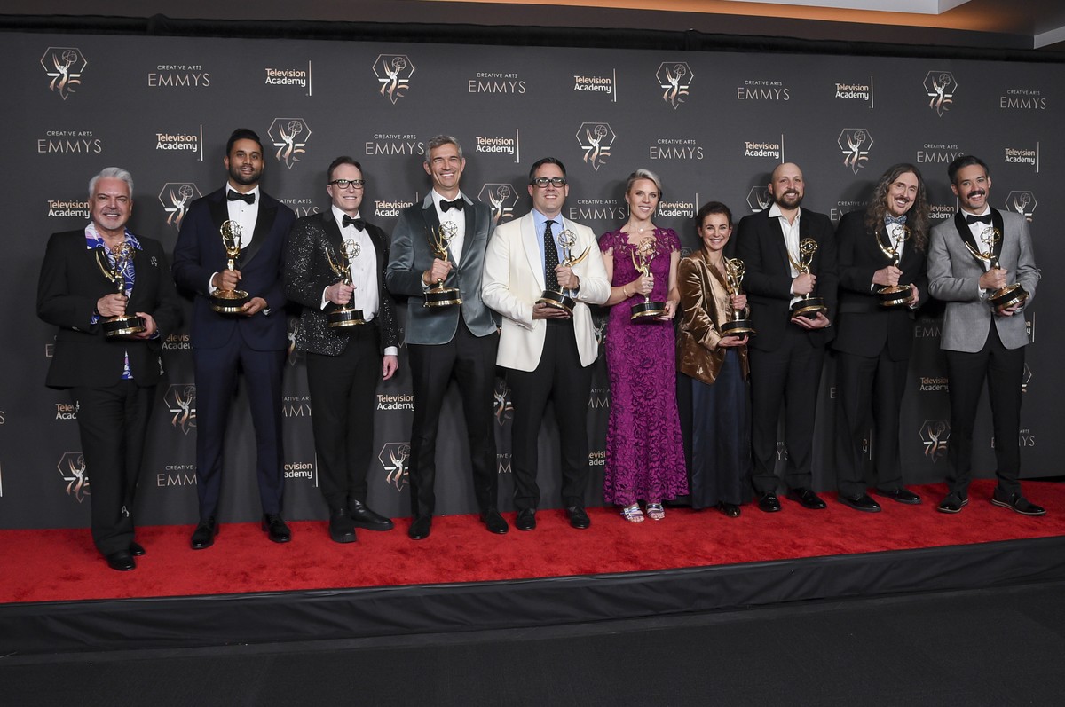 The team from "Weird: The Al Yankovic Story" pose in the press room with the award for outstanding television movie during night one of the Creative Arts Emmy Awards on Saturday, Jan. 6, 202 ...