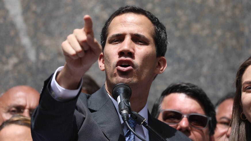 epa07319409 Head of the Venezuelan Parliament, Juan Guaido (C) speaks at a public event in the east of Caracas, Venezuela, 25 January 2019. Guaido, who two days ago announced that he assumed executive ...