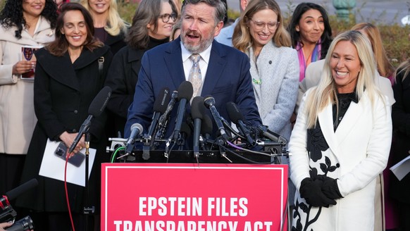 Rep. Thomas Massie, R-Ky., and Rep. Marjorie Taylor-Greene, R-Ga., right, speak during a news conference as the House prepares to vote on the Epstein Files Transparency Act, at the Capitol in Washingt ...