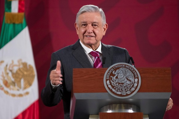 epa08443714 A handout photo made available by Mexican presidency shows Mexican President Andres Manuel Lopez Obrador, during a press conference at the National Palace in Mexico City, Mexico, 25 May 20 ...