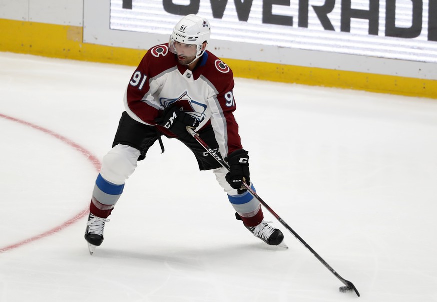 Colorado Avalanche center Nazem Kadri (91) prepares to make a pass in the second period of a preseason NHL hockey game against the Dallas Stars in Dallas, Saturday, Sept. 28, 2019. (AP Photo/Tony Guti ...