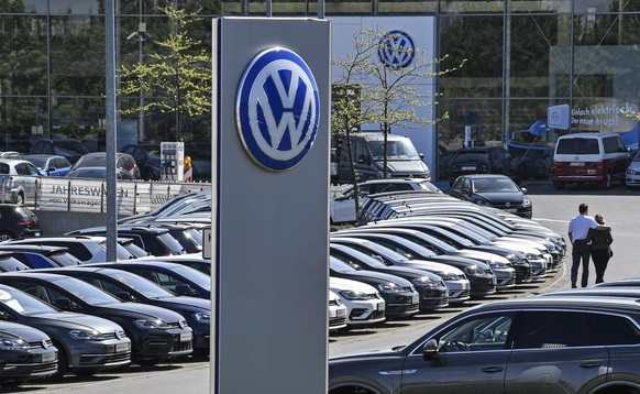 In this April 20, 2020 file photo, a Volkswagen car dealer is open in Essen, Germany. In times when a pandemic unleashes death and poverty, the concept of what is essential to keep society functioning ...