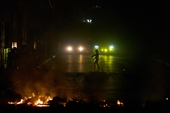 A woman walks in front of a barricade set up by residents protesting against prolonged power outages in Havana, Cuba, Wednesday, May 13, 2026. (AP Photo/Ramon Espinosa)
Cuba Energy Crisis