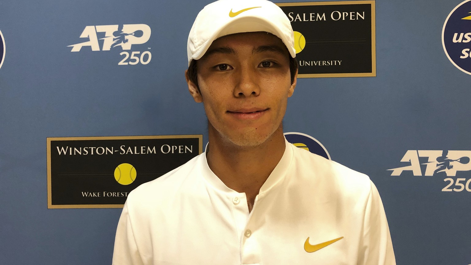 Tennis player Duckhee Lee, of South Korea, poses following his match, Monday, Aug. 19, 2019, at the Winston-Salem Open in Winston-Salem, N.C. Lee became the first deaf professional to play in an ATP-l ...