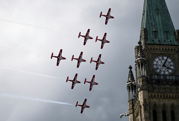 FILE - Royal Canadian Air Force (RCAF) Snowbirds conduct a fly-past over Parliament Hill during Canada Day celebrations at LeBreton Flats in Ottawa, Ontario, July 1, 2025. (Spencer Colby/The Canadian  ...