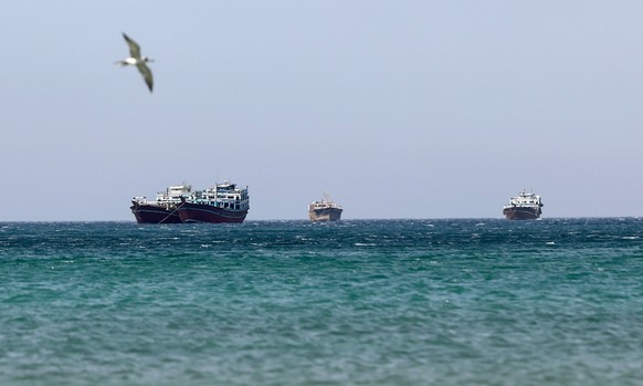 epa12194515 Ships in the Strait of Hormuz as seen from Khasab, Musandam Governorate, Oman, 24 June 2025. The Iranian parliament approved a measure to close the Strait of Hormuz following US strikes on ...
