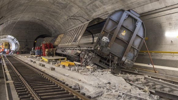 Accident-damaged freight wagons are seen at the scene of the accident in the Gotthard base tunnel near Faido during a media tour at the accident site on Wednesday, Sept. 6, 2023 in Faido in the canton ...