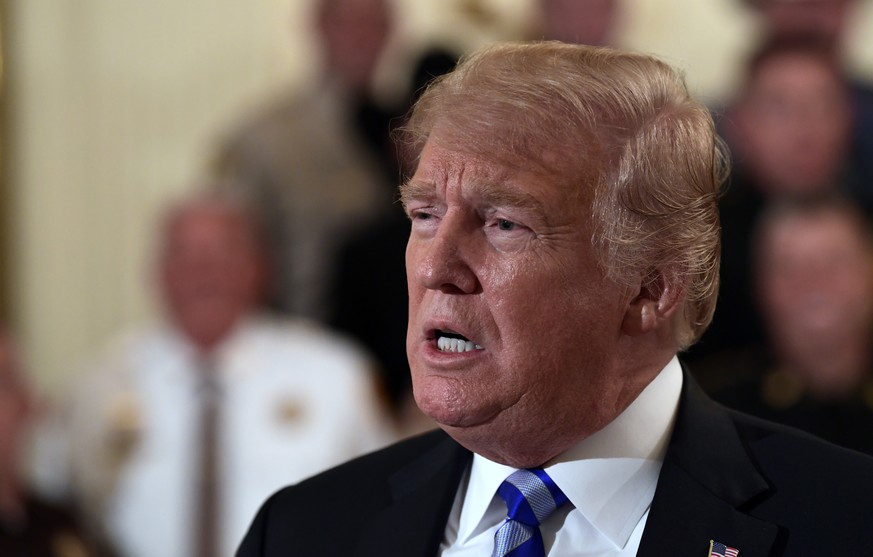 President Donald Trump responds to a reporters question during an event with sheriffs in the East Room of the White House in Washington, Wednesday, Sept. 5, 2018. (AP Photo/Susan Walsh)