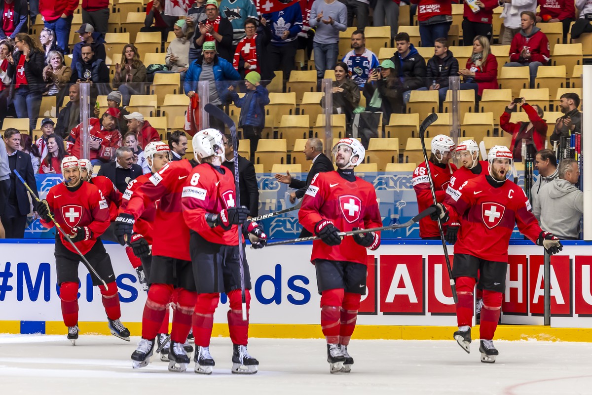 Switzerland's players celebrate their victory after defeating team Austria's, during the IIHF 2025 World Championship quarter final game between Switzerland and Austria, at the Jyske Bank Bo ...