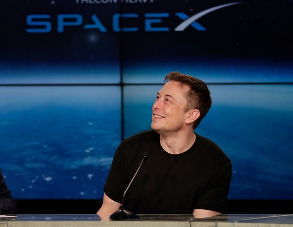 FILE - In this Feb. 6, 2018, file photo, Elon Musk, founder, CEO, and lead designer of SpaceX, speaks at a news conference from the Kennedy Space Center in Cape Canaveral, Fla. Musk is set to unveil a ...