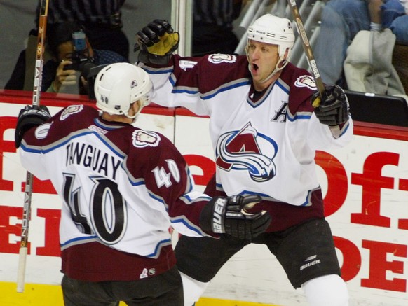 Colorado Avalanche defenseman Rob Blake, back, reacts after scoring his second goal of the game, on an assist from Alex Tanguay, front, in the second period of game two against the San Jose Sharks in  ...