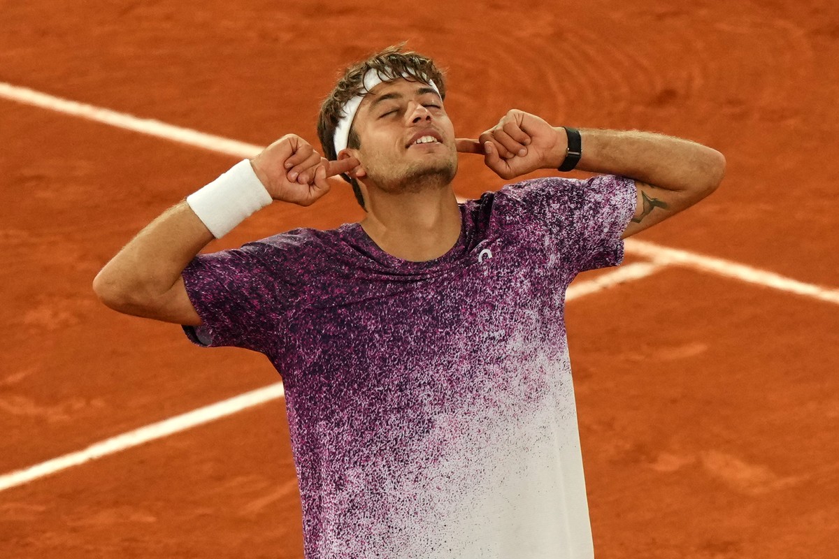 Italy's Flavio Cobolli reacts after winning the quarterfinal tennis match against Canada's Felix Auger-Aliassime at the French Open in Paris, Wednesday, June 3, 2026. (AP Photo/Aurelien Mori ...