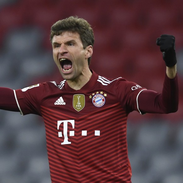 Bayern&#039;s Thomas Mueller celebrates after scoring his sides first goal during a German Bundesliga soccer match between Bayern Munich and VfL Wolfsburg at the Allianz Arena in Munich, Germany, Frid ...