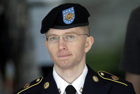 FILE - In this June 5, 2013, file photo Army Pvt. Chelsea Manning, then-Army Pfc. Bradley Manning, is escorted out of a courthouse in Fort Meade, Md., after the third day of his court martial. Advocat ...