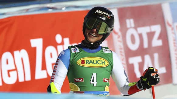 Switzerland&#039;s Lara Gut-Behrami smiles at the finish line during an alpine ski, women&#039;s World Cup giant slalom, in Soelden, Austria, Saturday, Oct. 23, 2021. (AP Photo/Marco Trovati)