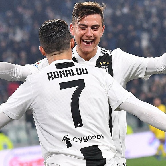 Juventus&#039; Cristiano Ronaldo celebrates with his teammate Paulo Dybala after scoring during the Serie A soccer match between Juventus and Frosinone at the Allianz Stadium in Turin, Italy, Friday,  ...