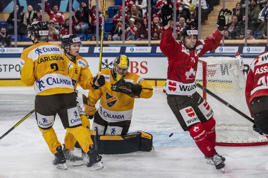 epa11048715 John Quenneville (R) from Canada reacts after the 5-0 lead during the game between Team Canada and Kalpa Kuopio of Finland at the 95th Spengler Cup ice hockey tournament in Davos, Switzerl ...