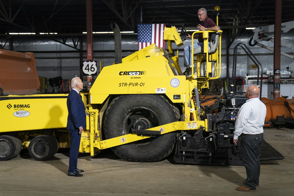 President Joe Biden participates in a tour of the La Crosse Municipal Transit Authority with Adam Lorentz, Transit Manager, La Crosse Municipal Transit Utility, right, and Mike La Fleur, the superinte ...