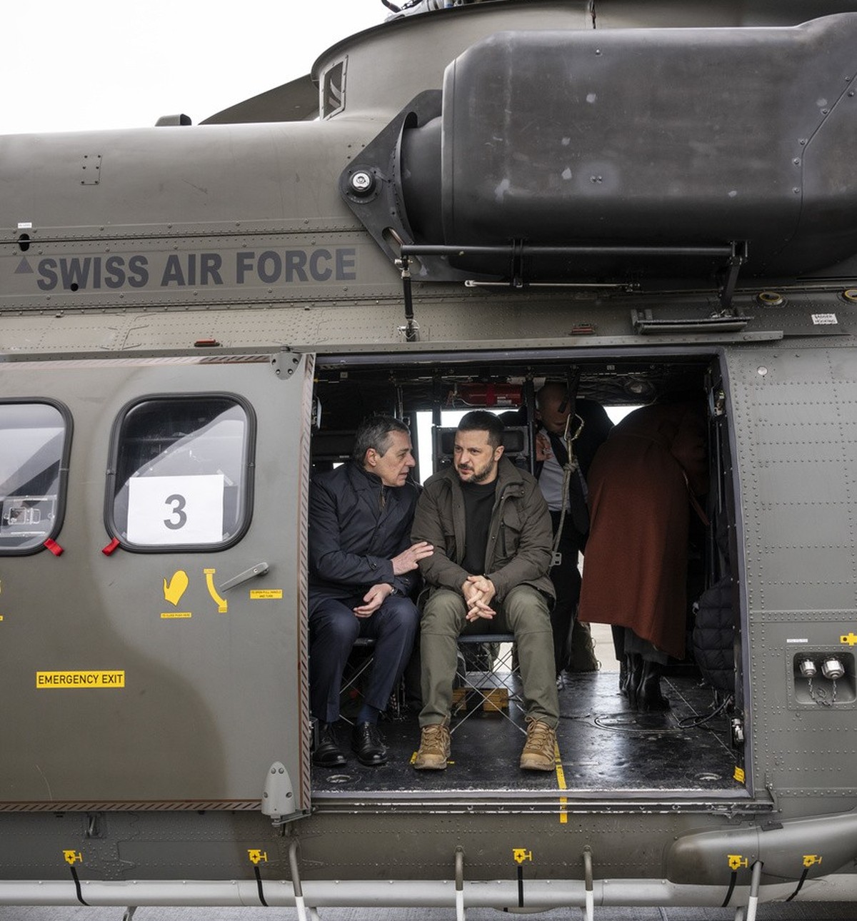 Switzerland's Foreign Minister Federal Councillor Ignazio Cassis, left, and his State guest Volodymyr Zelenskyy, President of Ukraine, right, get ready for takeoff in a Super Puma Helicopter of t ...