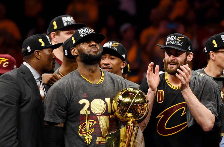 Jun 19, 2016; Oakland, CA, USA; Cleveland Cavaliers forward LeBron James (23) celebrates with the Larry O'Brien Championship Trophy after beating the Golden State Warriors in game seven of the NB ...