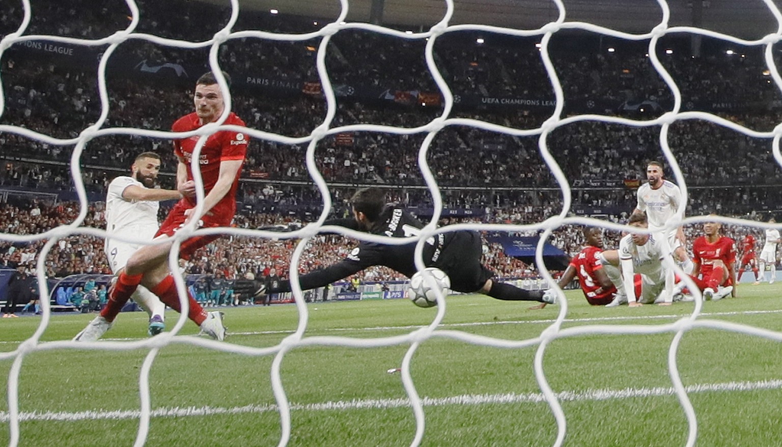 epa09983128 Karim Benzema (L) of Real Madrid scores but the goal is disallowed during the UEFA Champions League final between Liverpool FC and Real Madrid at Stade de France in Saint-Denis, near Paris ...