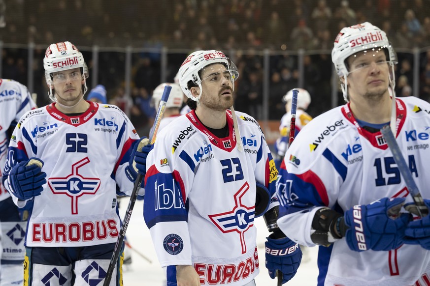 Kloten's Jesper Peltonen, Kloten's Jordan Bougreau, and Kloten's Miro Aaltonen, from left, react after a 5-0 loss in the preliminary ice hockey playoff, Game 3, of the National League between SC B...