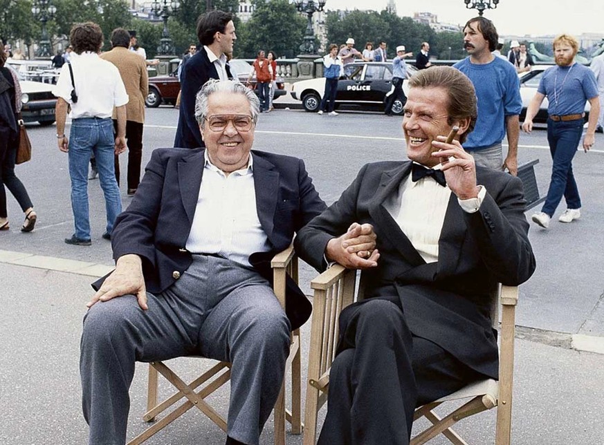 007-Producer Alfred R. Cubby Broccoli and Roger Moore as James Bond during the filming of A View to a Kill, 1985.