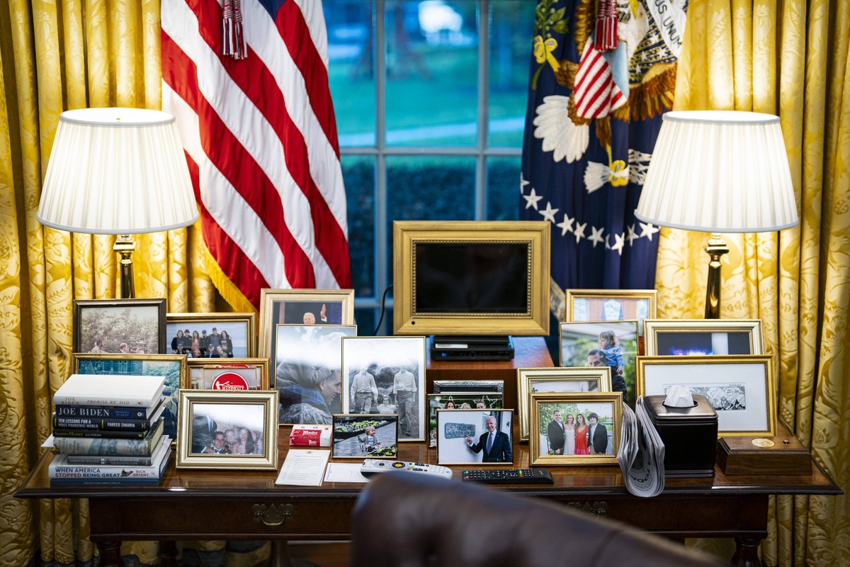 Family photos of President Joe Biden sit on a table behind the Resolute Desk during a meeting with Indonesian President Joko Widodo in the Oval Office of the White House in Washington, DC, on Monday,  ...