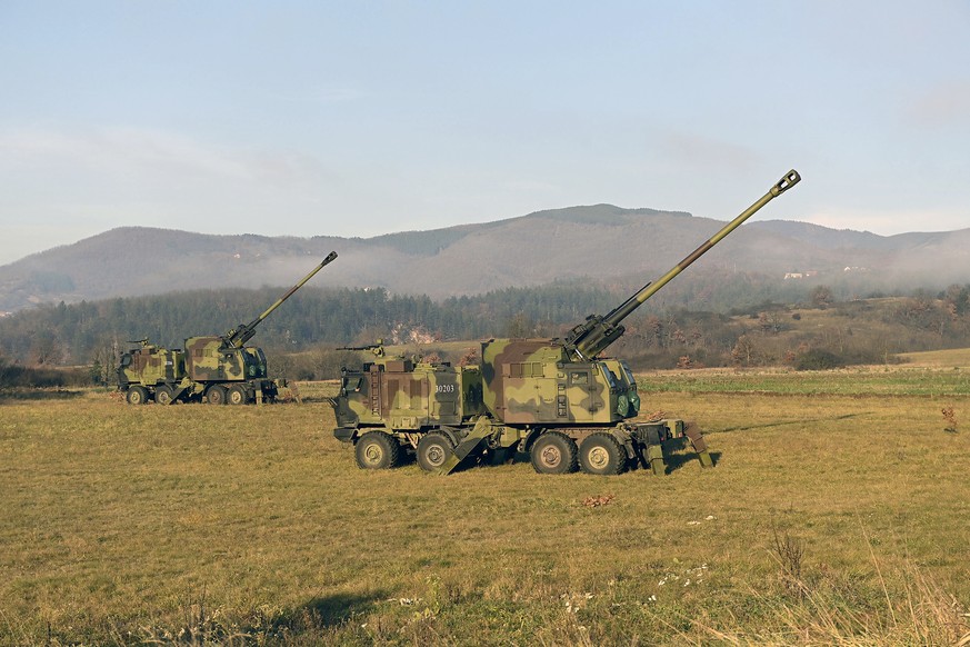 In this photo provided by the Serbian Defense Ministry Press Service, Serbian army self-propelled 155 mm gun-howitzers are seen on position near administrative line with Kosovo, south Serbia, Monday,  ...