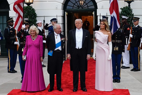 epa12920688 US President Donald Trump (2-R) and First Lady Melania Trump (R) greet Britain's King Charles III (2-L) and Queen Camilla (L) before a State Dinner at the White House in Washington, D ...
