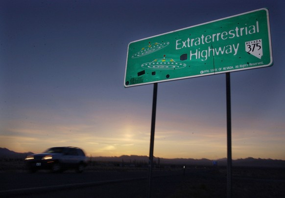 File - A car moves along the Extraterrestrial Highway near Rachel, Nevada, in this Wednesday, April 10, 2002 file photo. The CIA is acknowledging the existence of Area 51 in newly declassified documen ...