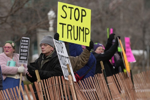 People gather for a protest against Project 2025, President Donald Trump, Elon Musk and other issues Wednesday, Feb. 5, 2025, in Cleveland. (AP Photo/Sue Ogrocki)
