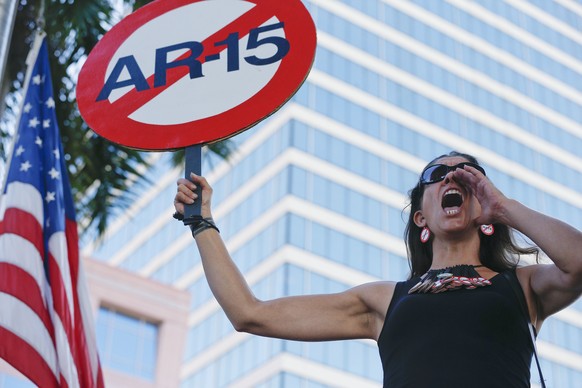 Alessandra Mondolfi holds a sign against AR-15 weapons as she yells, &quot;No More&quot; during a protest against guns on the steps of the Broward County Federal courthouse in Fort Lauderdale, Fla., o ...