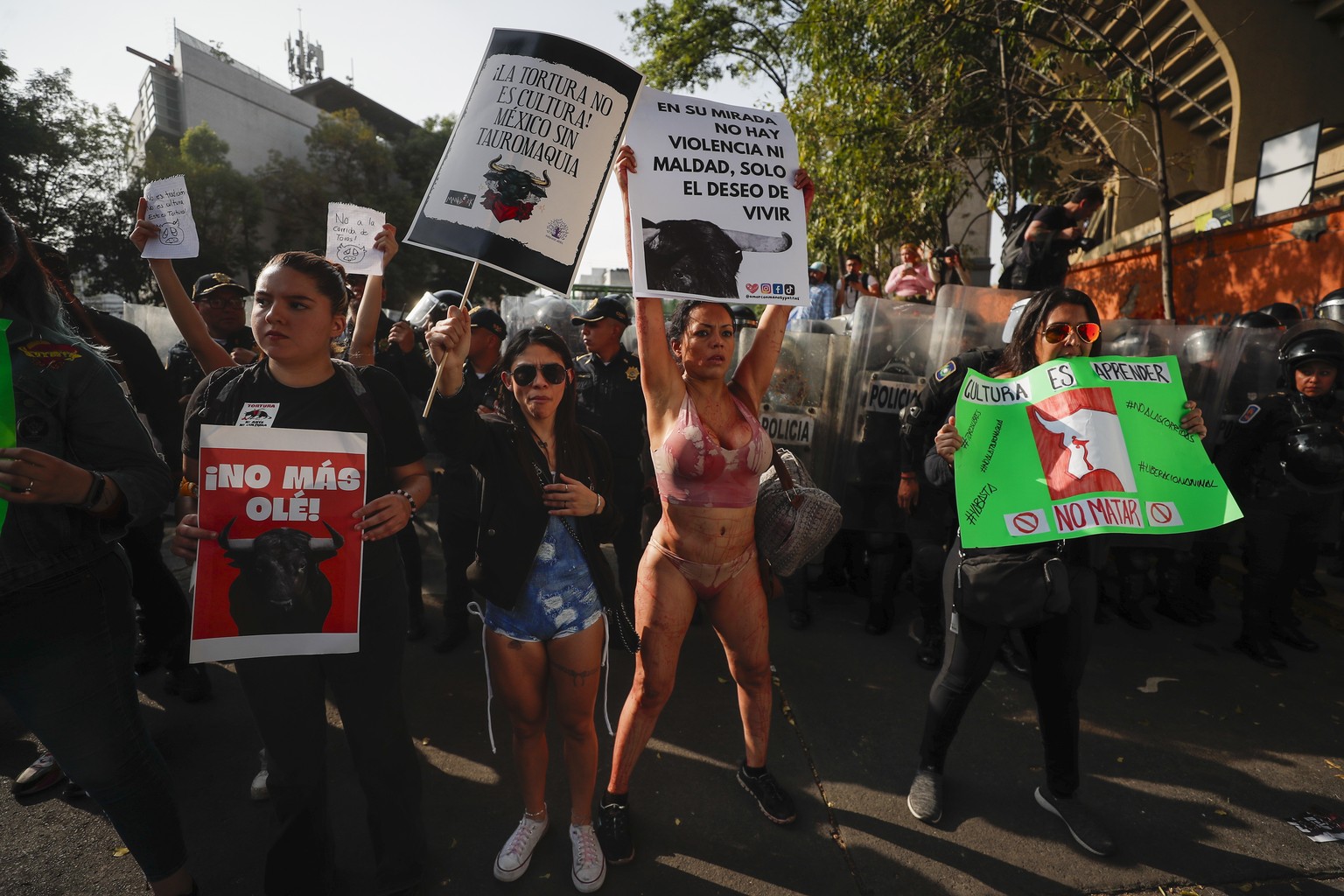 epa11111934 Demonstrators protest against the return of bullfighting, outside Plaza Mexico in Mexico City, Mexico, 28 January 2024. Dozens of people demonstrated in the streets of Mexico City against  ...