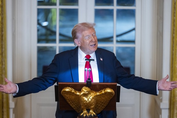 epa12456869 US President Donald Trump speaks ahead of a dinner to raise money for his ballroom extension in the East Room of the White House in Washington, DC, USA, 15 October 2025. The 27400-square-m ...