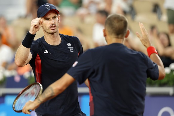 epa11516991 Andy Murray (L) and Daniel Evans of Great Britain interact during his Men&#039;s doubles quarter final of the Tennis competitions in the Paris 2024 Olympic Games, at the Roland Garros in P ...