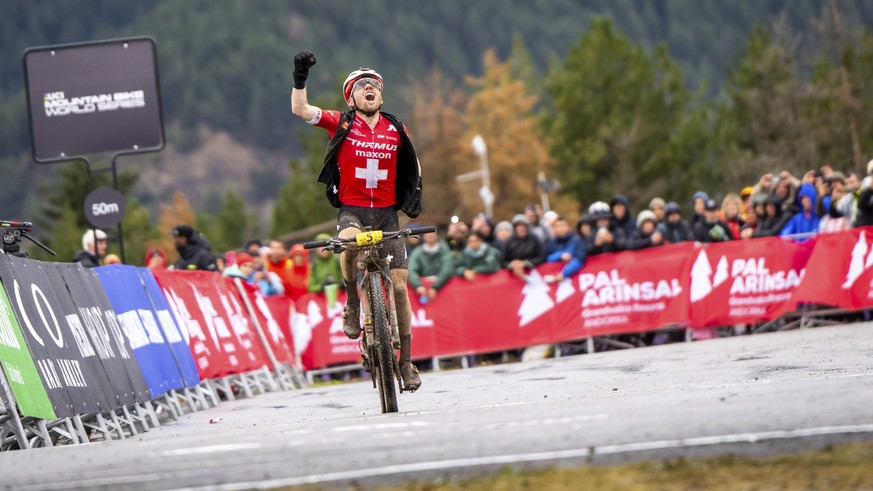 Mathias Flueckiger from Switzerland crosses the finish line of the MTB Cross Country Men Elite race of the Mountain Bike World Cup, in Vallnord Andorra, in Switzerland, Sunday, Aug. 27, 2023. (Maxime  ...