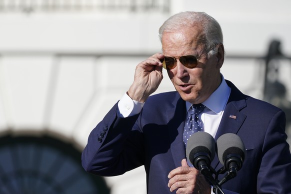 President Joe Biden puts on his sunglasses after stopping by to talk to the 2020 and 2021 State and National Teacher of the Year recipients during an event on the South Lawn of the White House in Wash ...