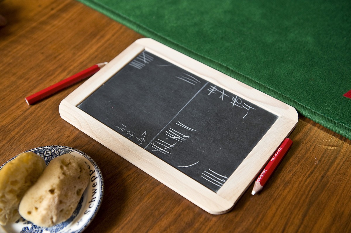 A slate to keep track of the points made during the traditional Swiss card game "Jassen" lies on a table at the restaurant Ochsen in Luetzelflueh in the canton of Berne, Switzerland, picture ...