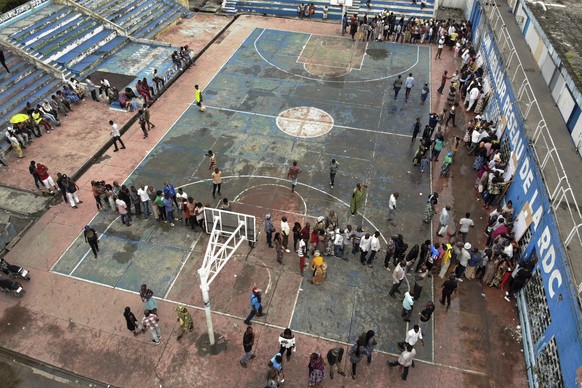 Congolese voters line up to vote in Kinshasa, Sunday Dec. 30, 2018. Forty million voters are registered for a presidential race plagued by years of delay and persistent rumors of lack of preparation.  ...