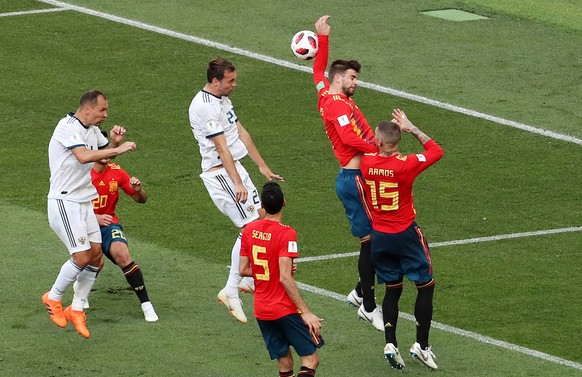 epa06855092 The ball hits the arm of Gerard Pique of Spain which results in a penalty during the FIFA World Cup 2018 round of 16 soccer match between Spain and Russia in Moscow, Russia, 01 July 2018.
 ...