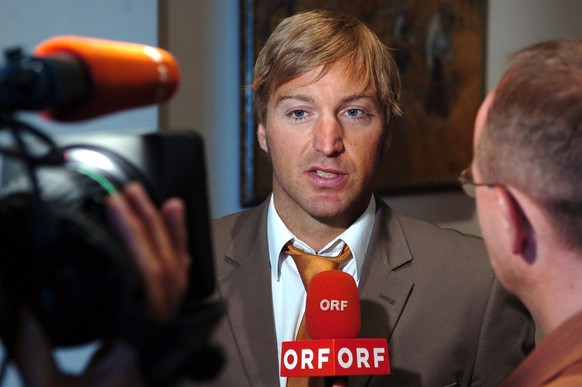 Austrian skier Hans Knauss answers questions of a tv crew of the Austrian Television ORF after a hearing at the Court of Arbitration for Sport, CAS, in Lausanne, Switzerland, Monday, June 27, 2005. Kn ...