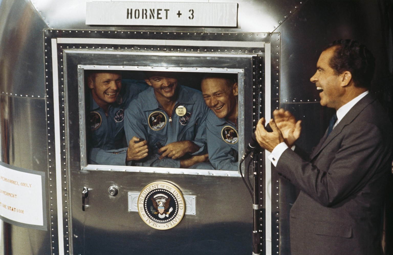 24th July 1969: From left to right, Neil Armstrong, Michael Collins and Edwin 'Buzz' Aldrin Jnr, the crew of the historic Apollo 11 moon landing mission are subjected to a period of quaranti ...