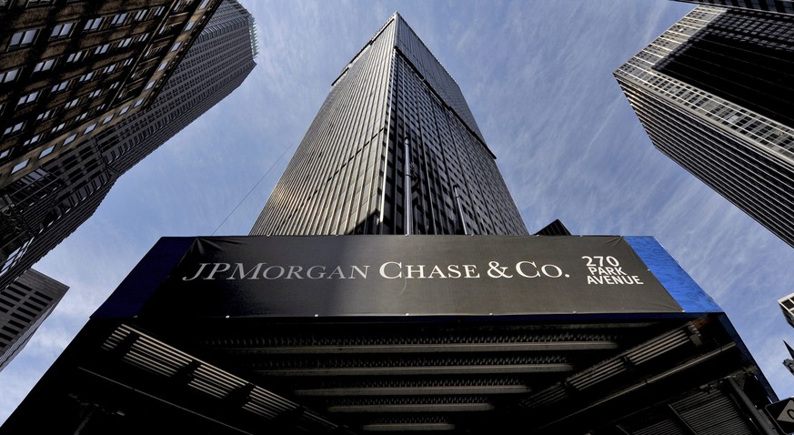 epa04317034 (FILE) A file photo dated 16 April 2009 showing a sign at a JPMorgan Chase building in New York, New York, USA. Second quarter net profits at JPMorgan Chase, the largest US bank by assets, ...