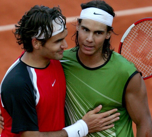 Spain's Rafael Nadal (R) is congratulated by his opponent Swiss Roger Federer after the semi final match at the French Open in Roland Garros, Paris, Friday 03 June 2005. Nadal won 6-3, 4-6, 6-4,  ...