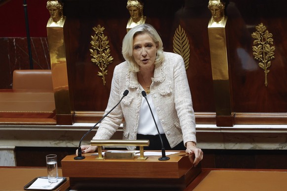 epa12362513 French leader of the far-right party &amp;#x2018;Rassemblement National&#039; (RN), Marine Le Pen, gives her speech as the French prime minister and his government face a vote of confidenc ...