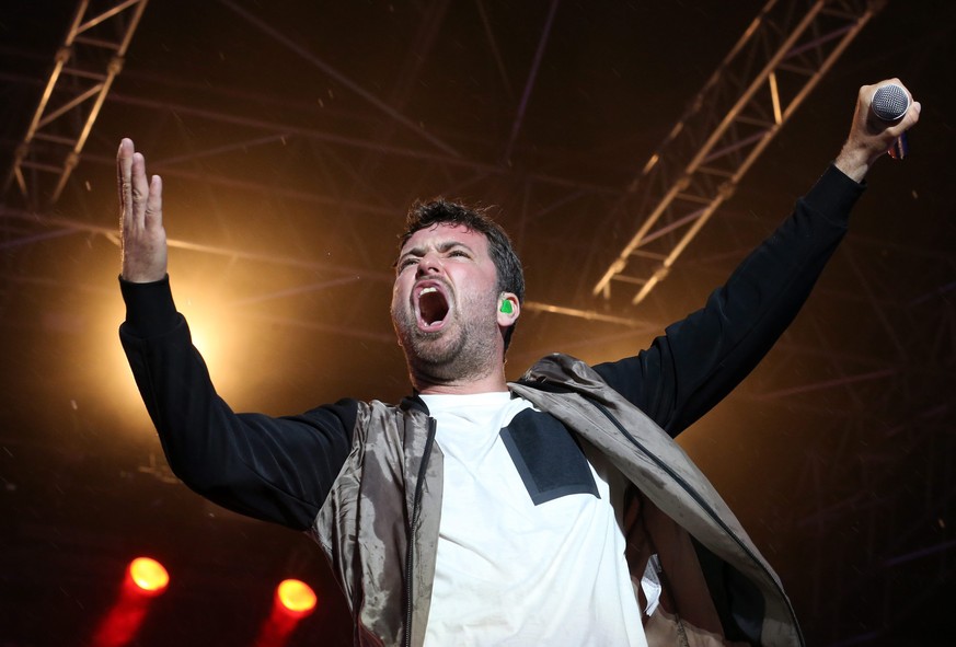 epa04798013 German rapper Marteria performs during his concert at IGA-Park in Rostock, Germany, 13 June 2015. More than 20,000 people were expected to the rapper&#039;s @zum Glueck in die Zuckungt II& ...