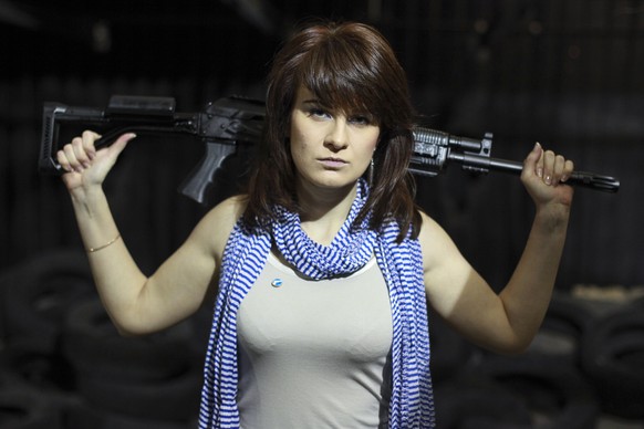 In this photo taken on Sunday, April 22, 2012, Maria Butina, a gun-rights activist, poses for a photo at a shooting range in Moscow, Russia. When gun activist Maria Butina arrived in Washington in 201 ...