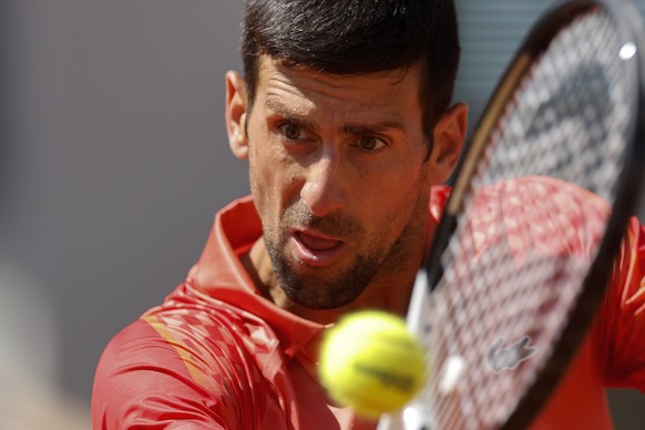 Serbia&#039;s Novak Djokovic plays a shot against Aleksandar Kovacevic of the U.S. during their first round match of the French Open tennis tournament at the Roland Garros stadium in Paris, Monday, Ma ...